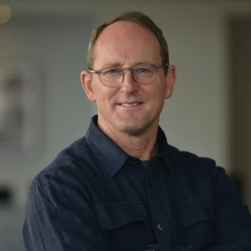 Headshot of Matt smiling. He is wearing a navy shirt.